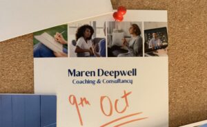 A pinboard with postcards and images, with the date 9th October