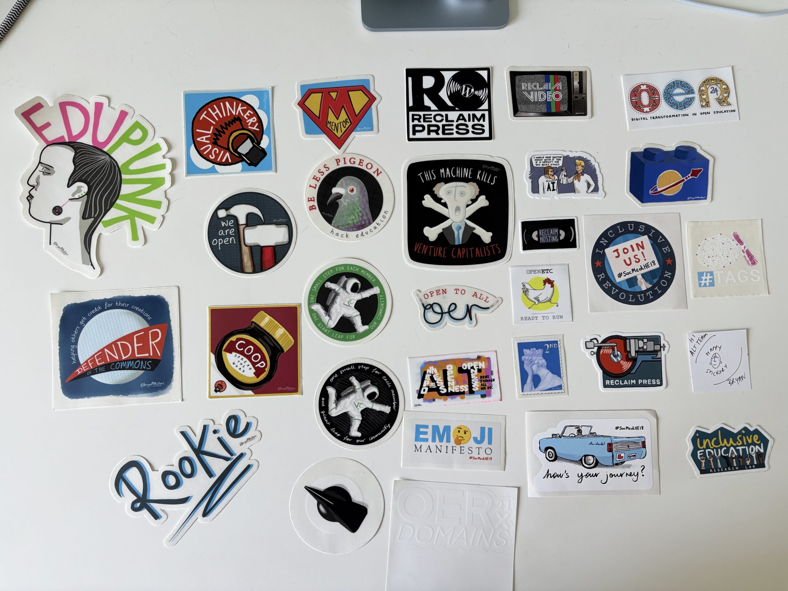 Photo of laptop stickers arranged on my desk