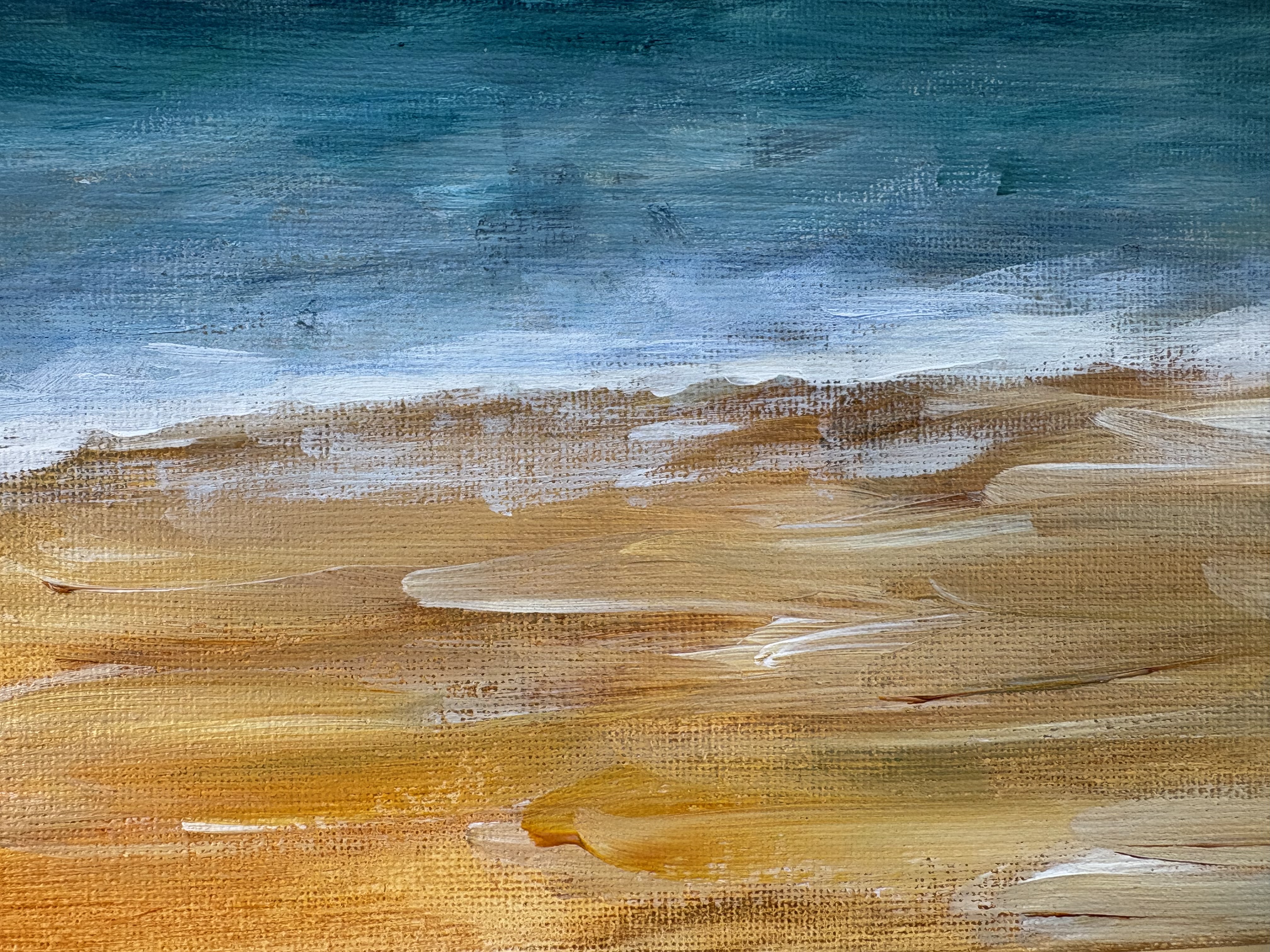 Close up of a painting of surf and sand.